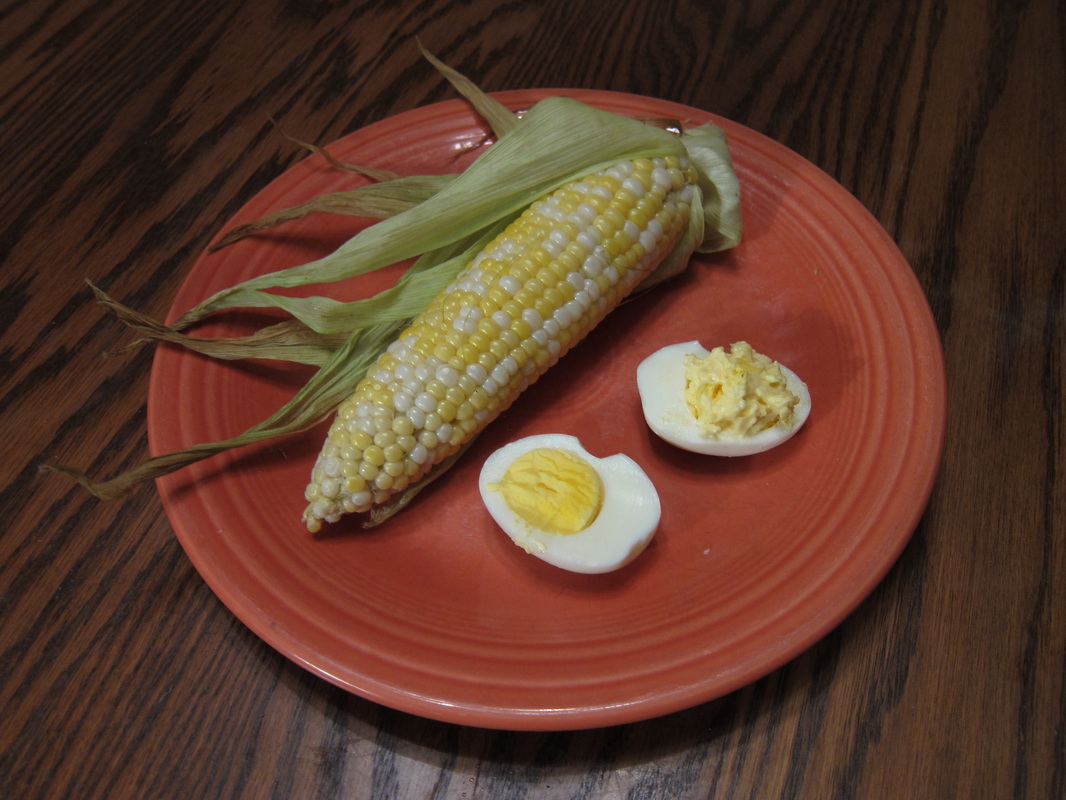 Baked or broiled corn on the cob and baked deviled eggs