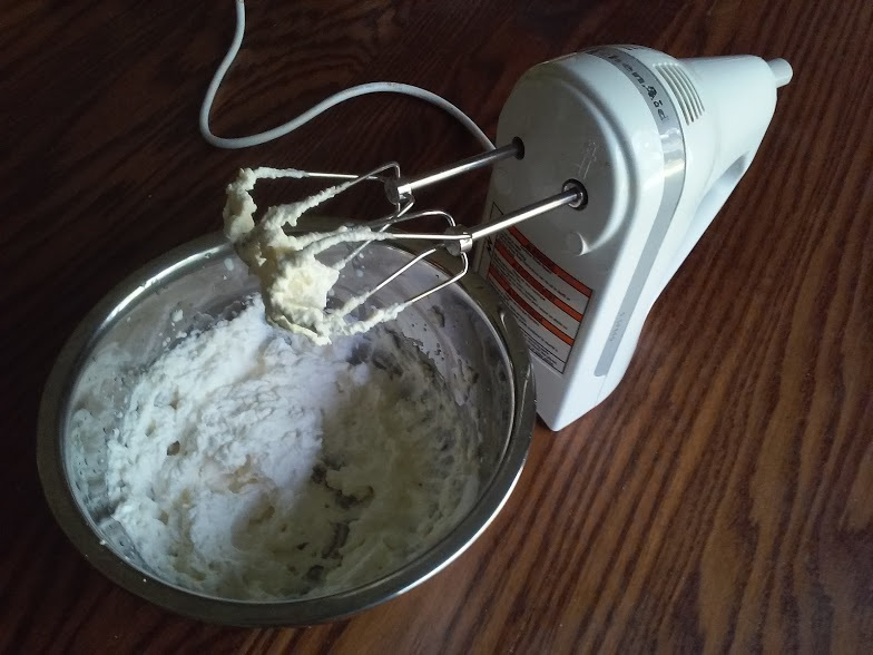 Mixer and frozen mixing bowl with whipped cream