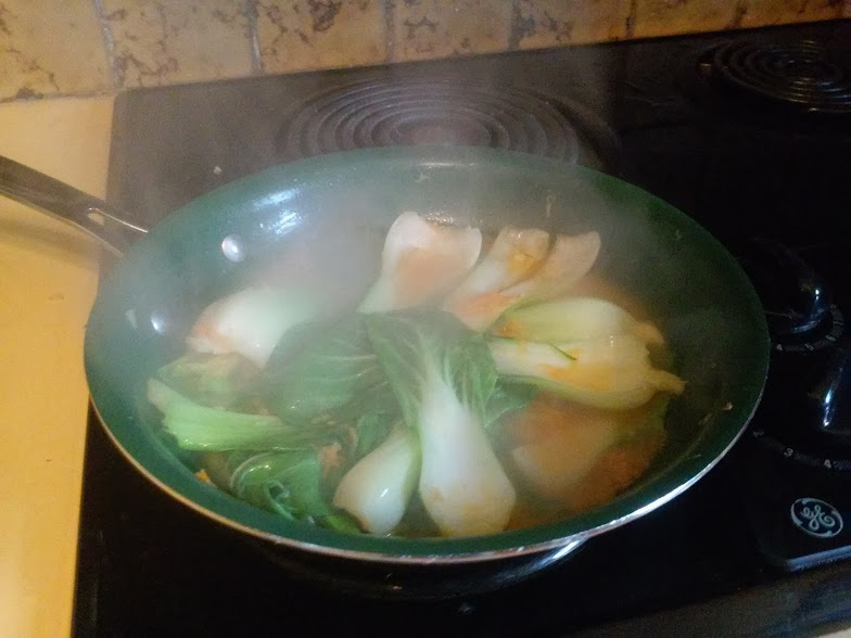 Garlic ginger bok choy in fry pan